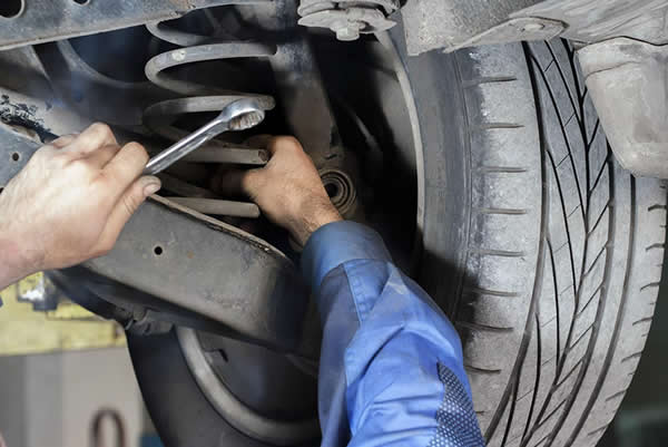 photo of automotive suspension being repaired